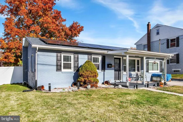 a view of a house with backyard patio and swimming pool