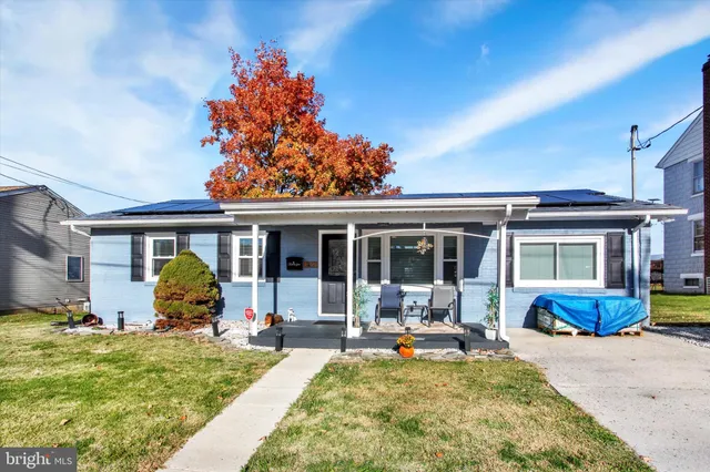 a view of a dining room with furniture and window
