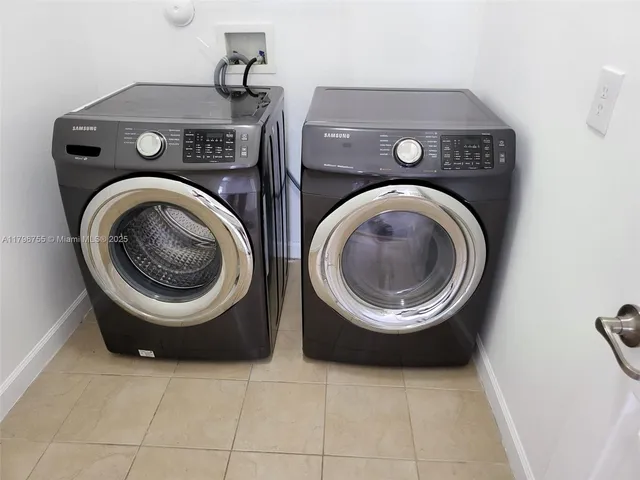 a view of washer and dryer in a utility room