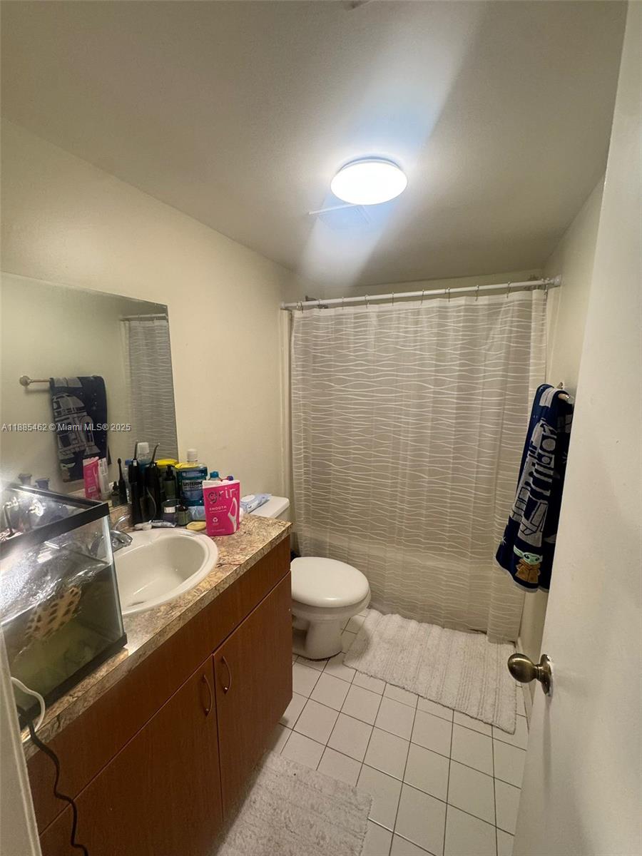 6900 Southwest 39th Street, Unit 106J Davie, FL 33314 - Photo 7 of 9 a bathroom with a sink toilet and shower