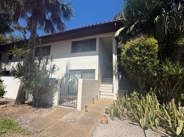 a house with trees in front of it