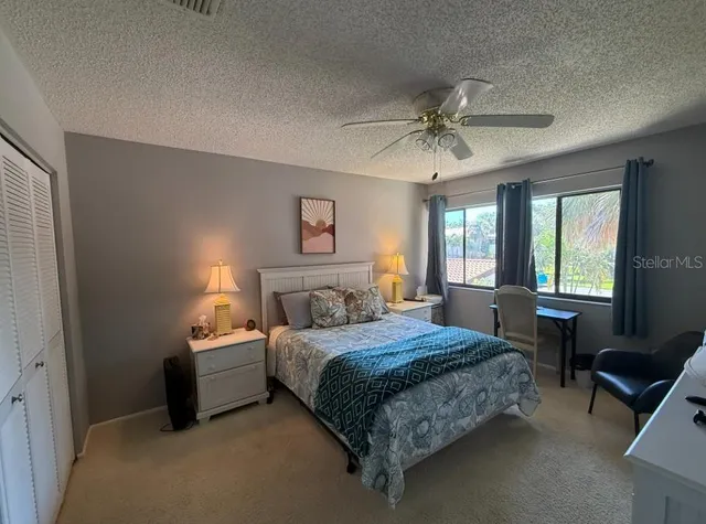 a bedroom with a bed and a table in it