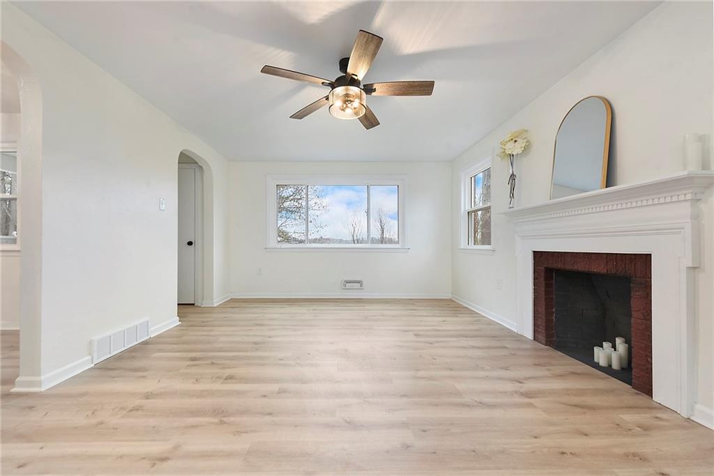 657 Ridge Road Pittsburgh, PA 15205 - Photo 11 of 30 a view of an empty room with a fireplace and a window