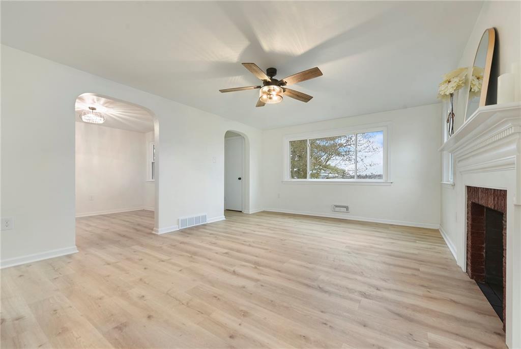 657 Ridge Road Pittsburgh, PA 15205 - Photo 13 of 30 wooden floor in an empty room with a fireplace