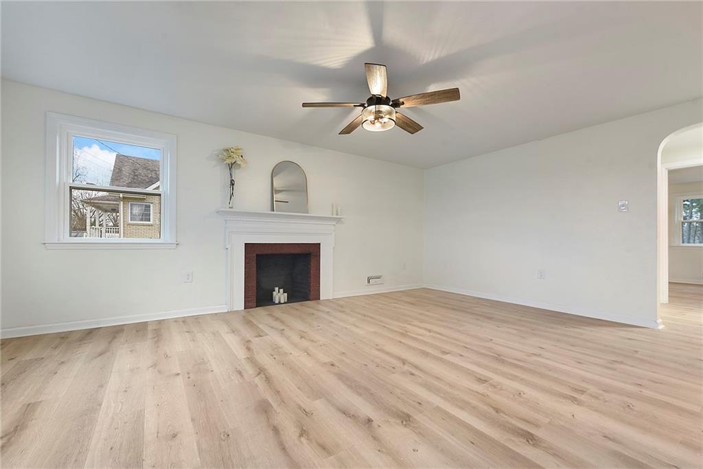 657 Ridge Road Pittsburgh, PA 15205 - Photo 14 of 30 a view of empty room with wooden floor and fan