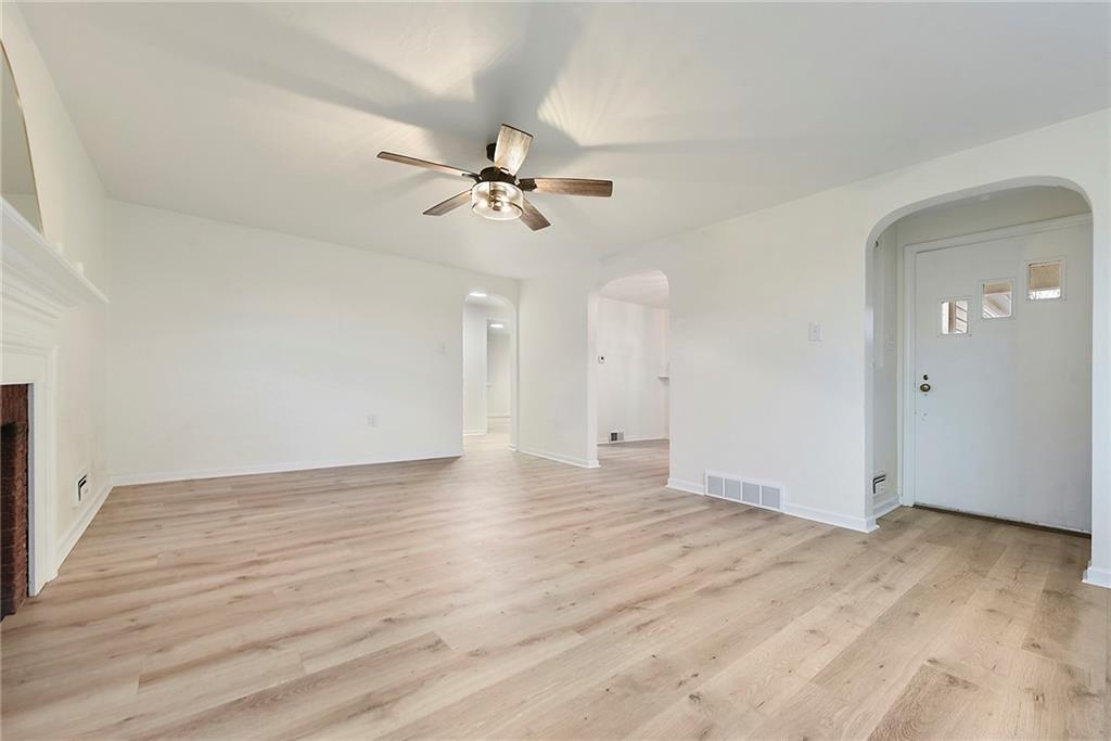 657 Ridge Road Pittsburgh, PA 15205 - Photo 16 of 30 a view of empty room with wooden floor and ceiling fan
