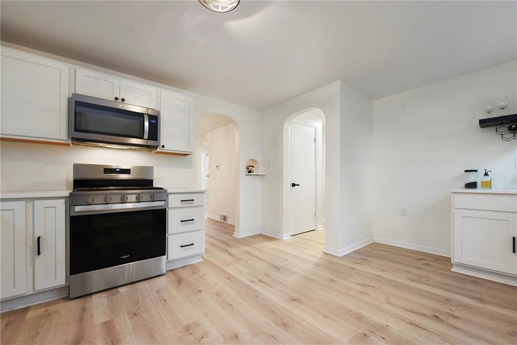 657 Ridge Road Pittsburgh, PA 15205 - Photo 6 of 30 a kitchen with a stove and a microwave
