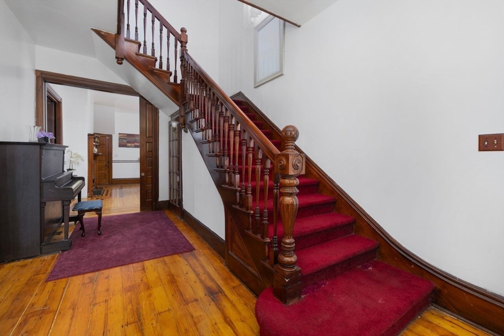 311 Elm Street Woonsocket, RI 02895 - Photo 18 of 29 a view of staircase with a rug