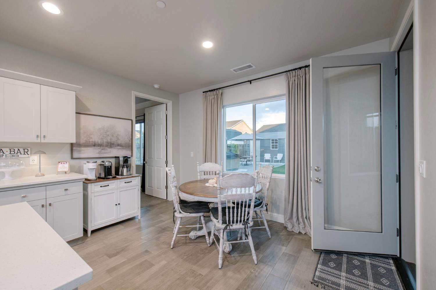 2121 Descanso Avenue Clovis, CA 93619 - Photo 19 of 37 a kitchen with granite countertop a sink dining table and chairs