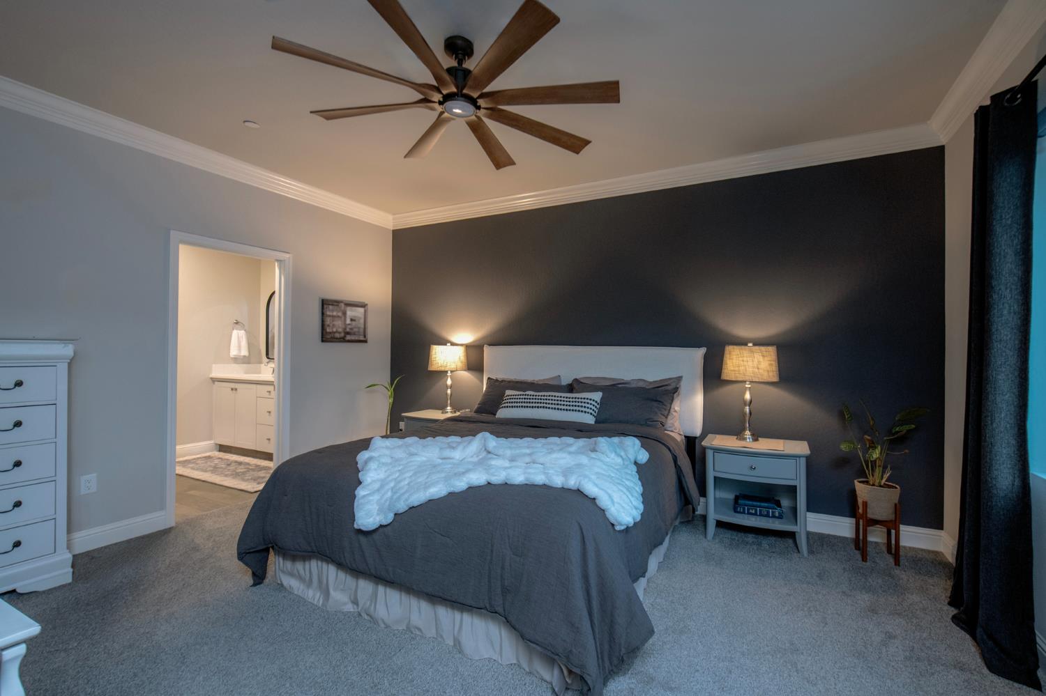 2121 Descanso Avenue Clovis, CA 93619 - Photo 20 of 37 a bedroom with a bed a ceiling fan and a dresser