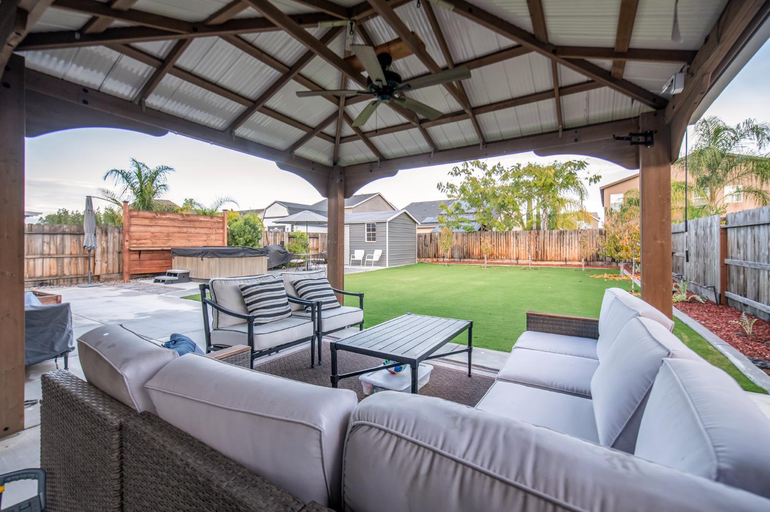 2121 Descanso Avenue Clovis, CA 93619 - Photo 27 of 37 a view of a patio with couches chairs and a backyard
