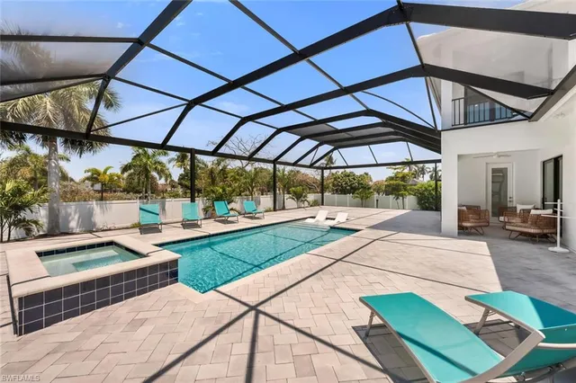 a view of a backyard with sitting area