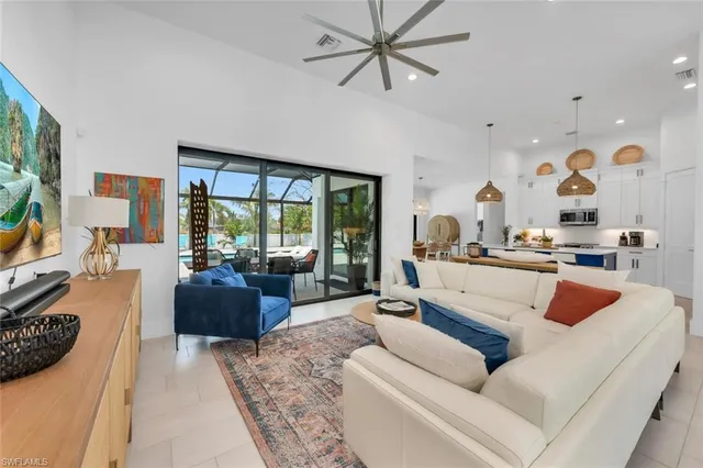 a living room with furniture or couch and a large window