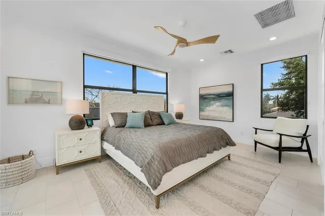 a spacious bathroom with a shower sink and mirror