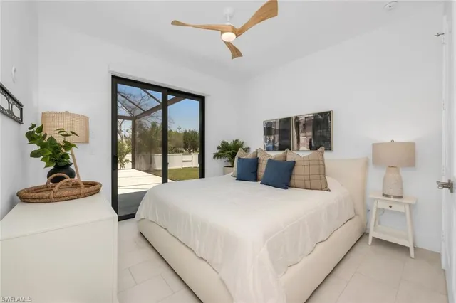 a bathroom with a double vanity sink toilet and shower