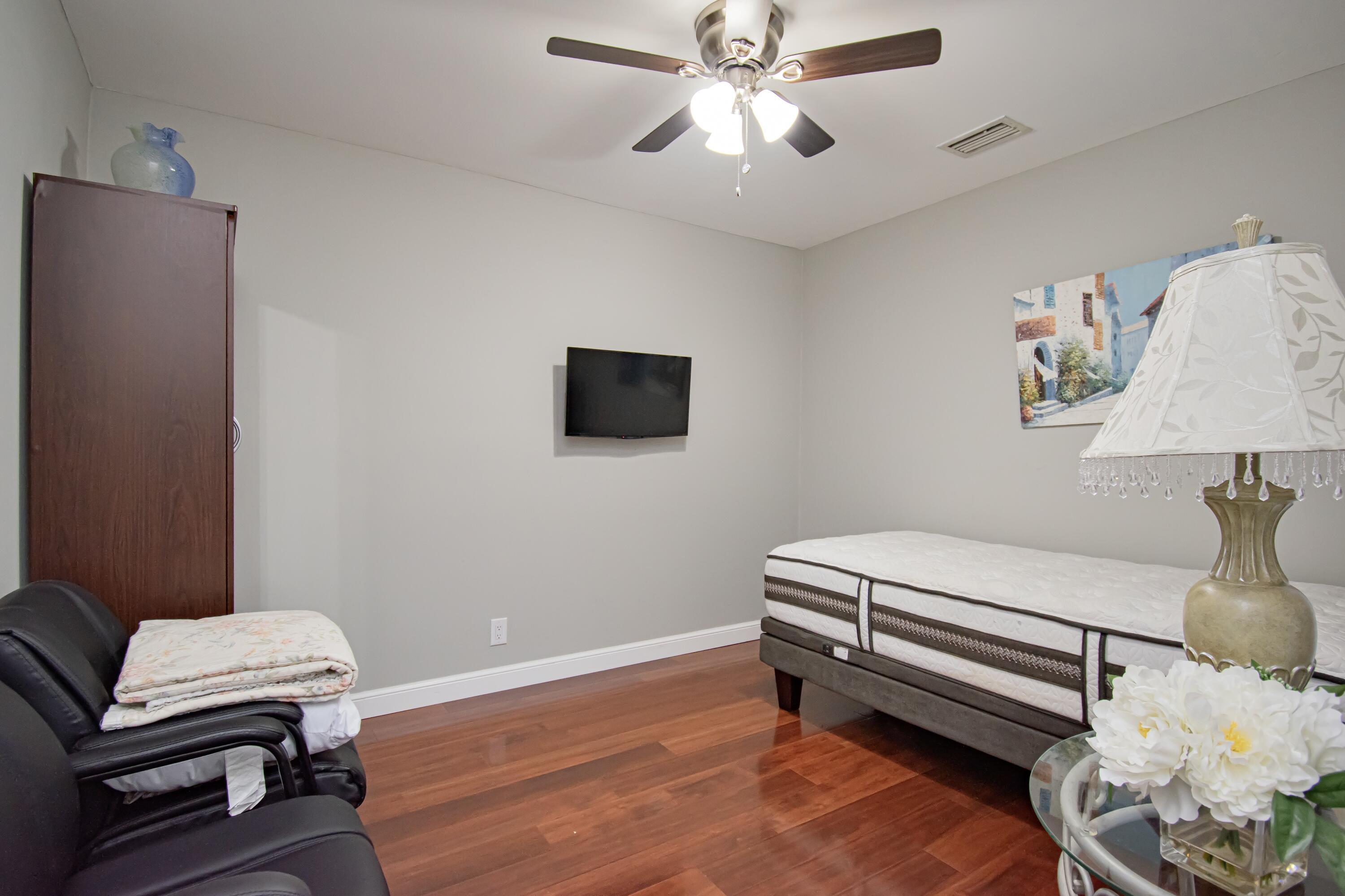 7838 Cypress Crescent Boca Raton, FL 33433 - Photo 20 of 24 a room with furniture and wooden floor