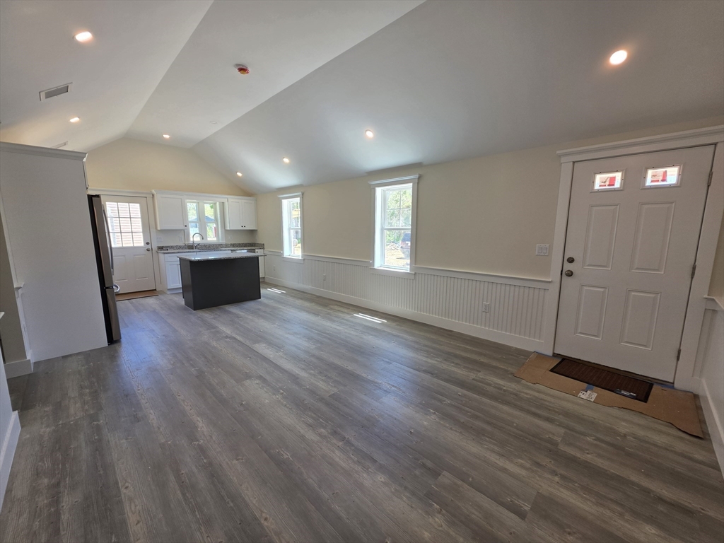 87 Acapesket Road, Unit 2B Falmouth, MA 02536 - Photo 6 of 17 an empty room with wooden floor and window