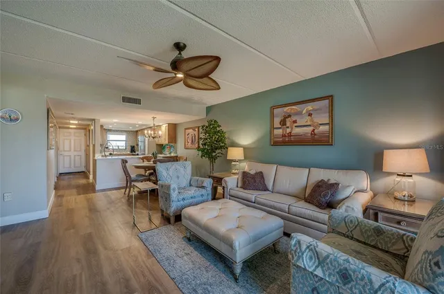a view of hallway with wooden floor