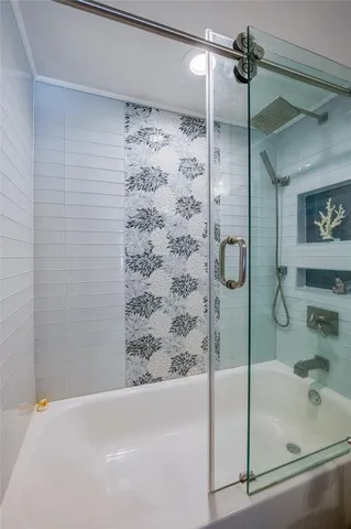 a bedroom with two beds and a chandelier