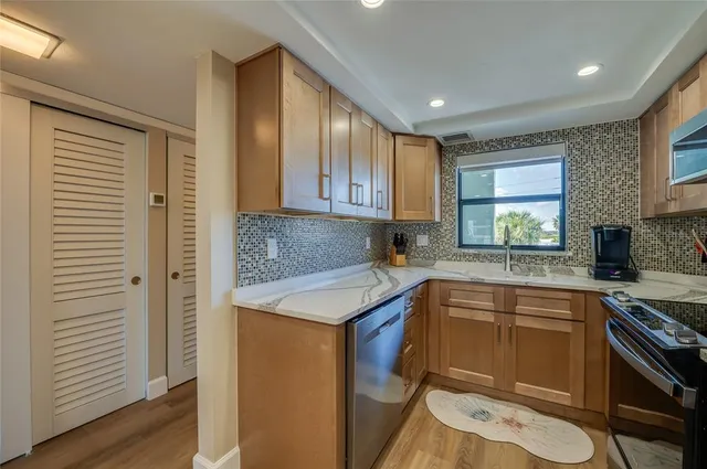 a view of living room with granite countertop furniture and a flat screen tv