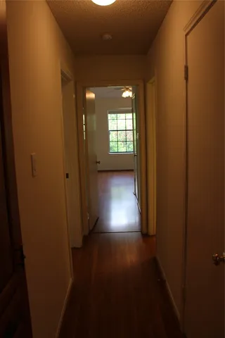 a view of gallery with wooden floor