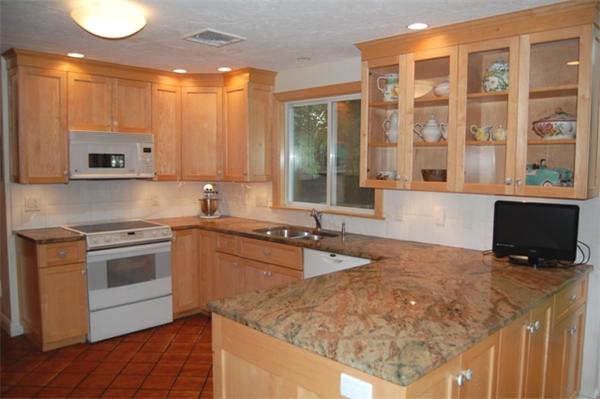 11 John Poulter Road Lexington, MA 02421 - Photo 8 of 27 a kitchen with stainless steel appliances granite countertop a sink stove and microwave