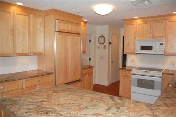 11 John Poulter Road Lexington, MA 02421 - Photo 9 of 27 a kitchen with stainless steel appliances granite countertop a refrigerator and a stove top oven