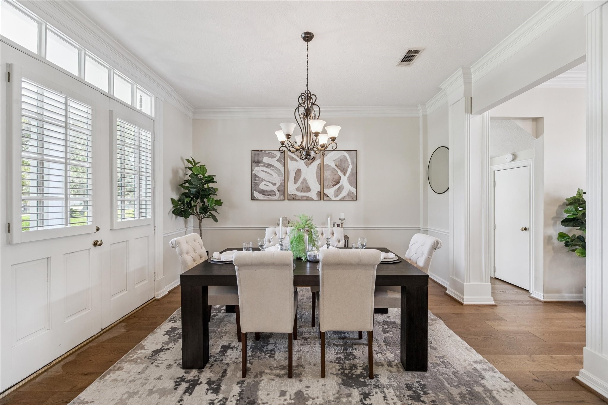 3577 Katy Hockley Road Katy, TX 77493 - Photo 17 of 50 A sophisticated dining room features crown molding, plantation shutters, and space for memorable gatherings.
