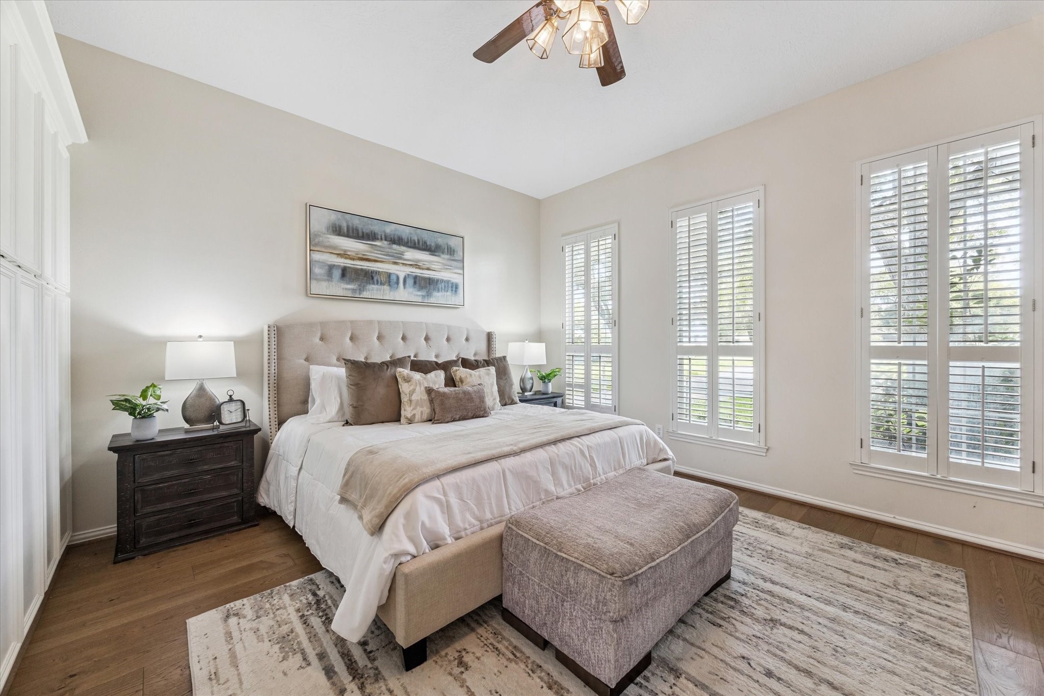 3577 Katy Hockley Road Katy, TX 77493 - Photo 27 of 50 The primary suite exudes serenity, with wood floors, high ceilings, and abundant natural light.