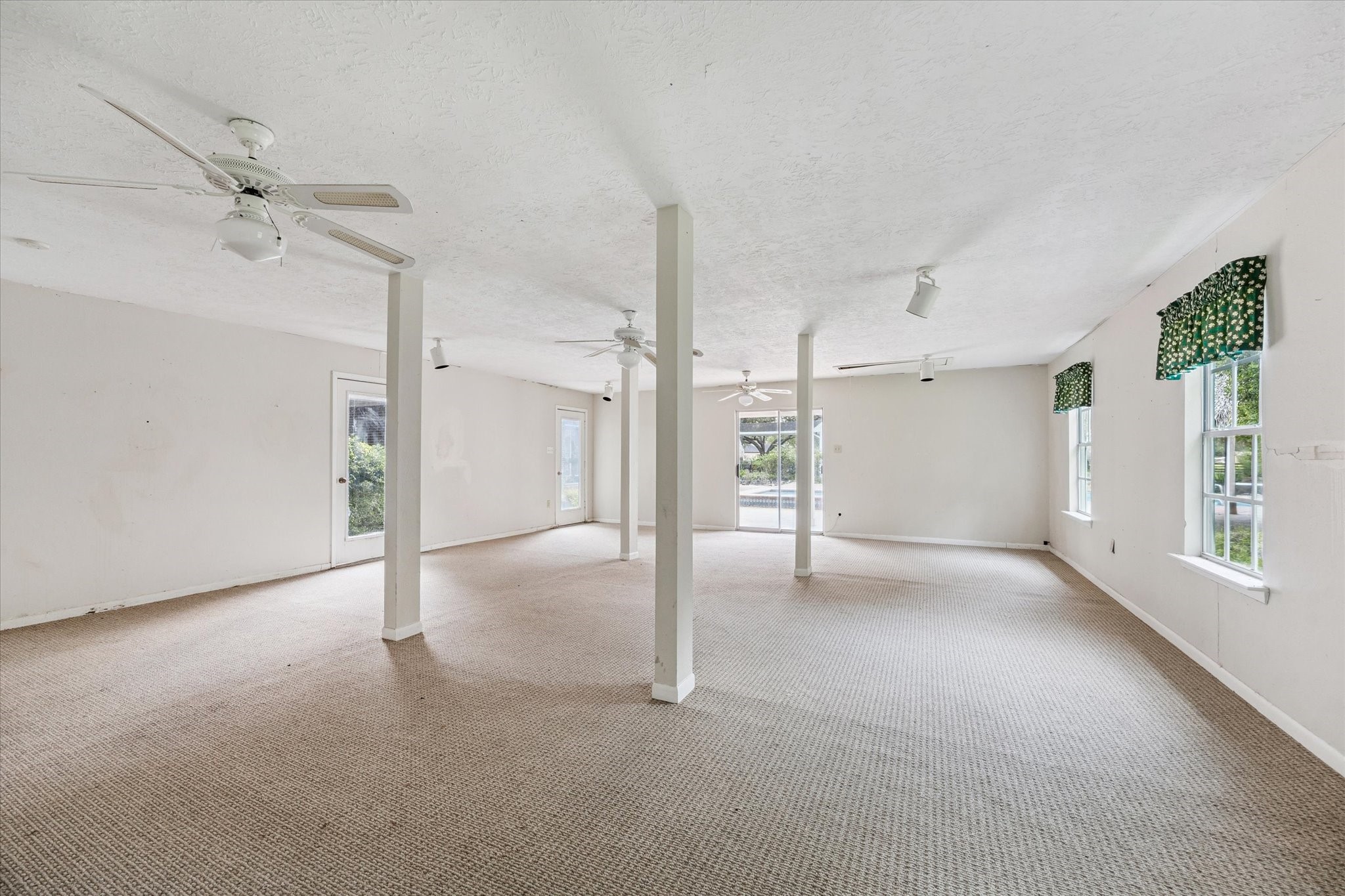 3577 Katy Hockley Road Katy, TX 77493 - Photo 37 of 50 Expansive pool house with abundant natural light, direct pool access, and endless possibilities for entertaining or recreation.