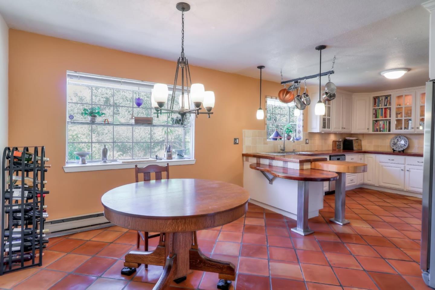 809 C Lewis Road Watsonville, CA 95076 - Photo 5 of 41 a kitchen with a table chairs and a chandelier