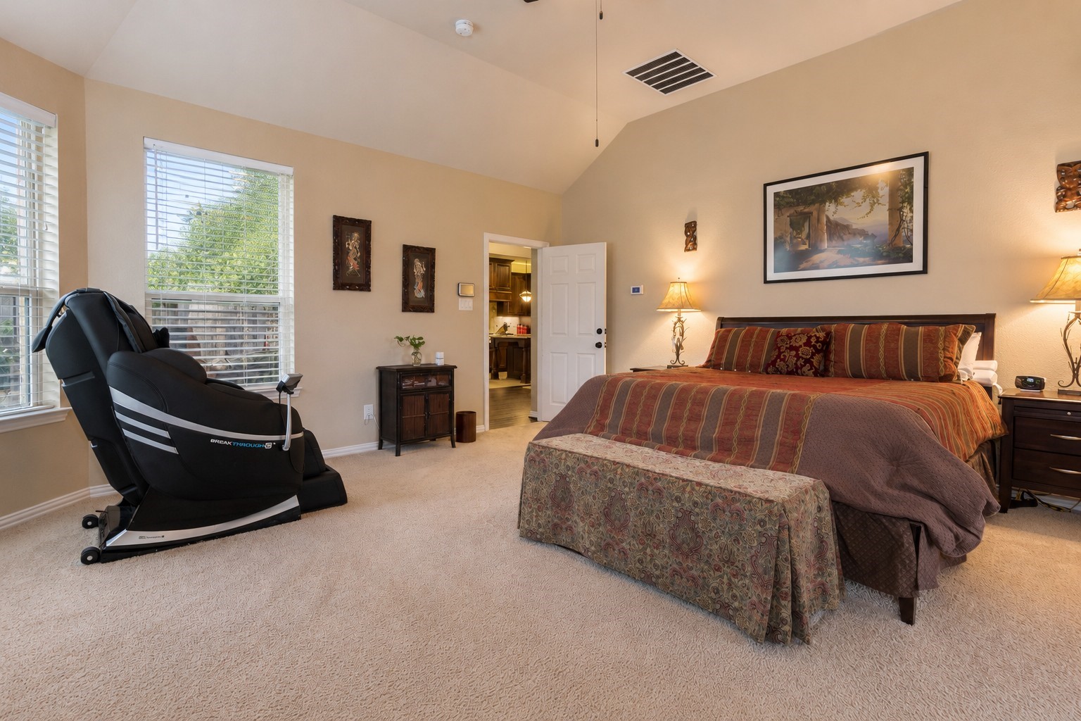 2326 Hamilton Pool Lane Friendswood, TX 77546 - Photo 21 of 49 a spacious bedroom with a bed a table and chair