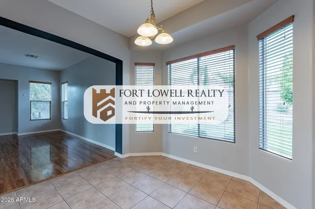a view of a room with a wooden floor