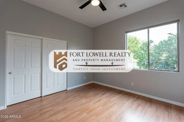 a view of outdoor space with signage and flags