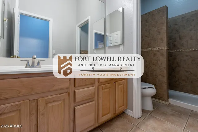 a view of a house with a garden and signage