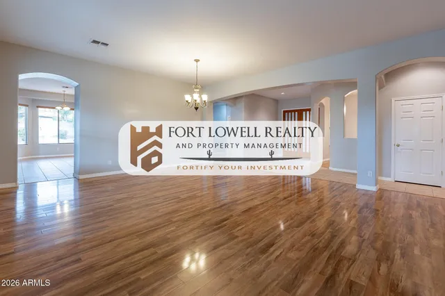 a view of a room with wooden floor