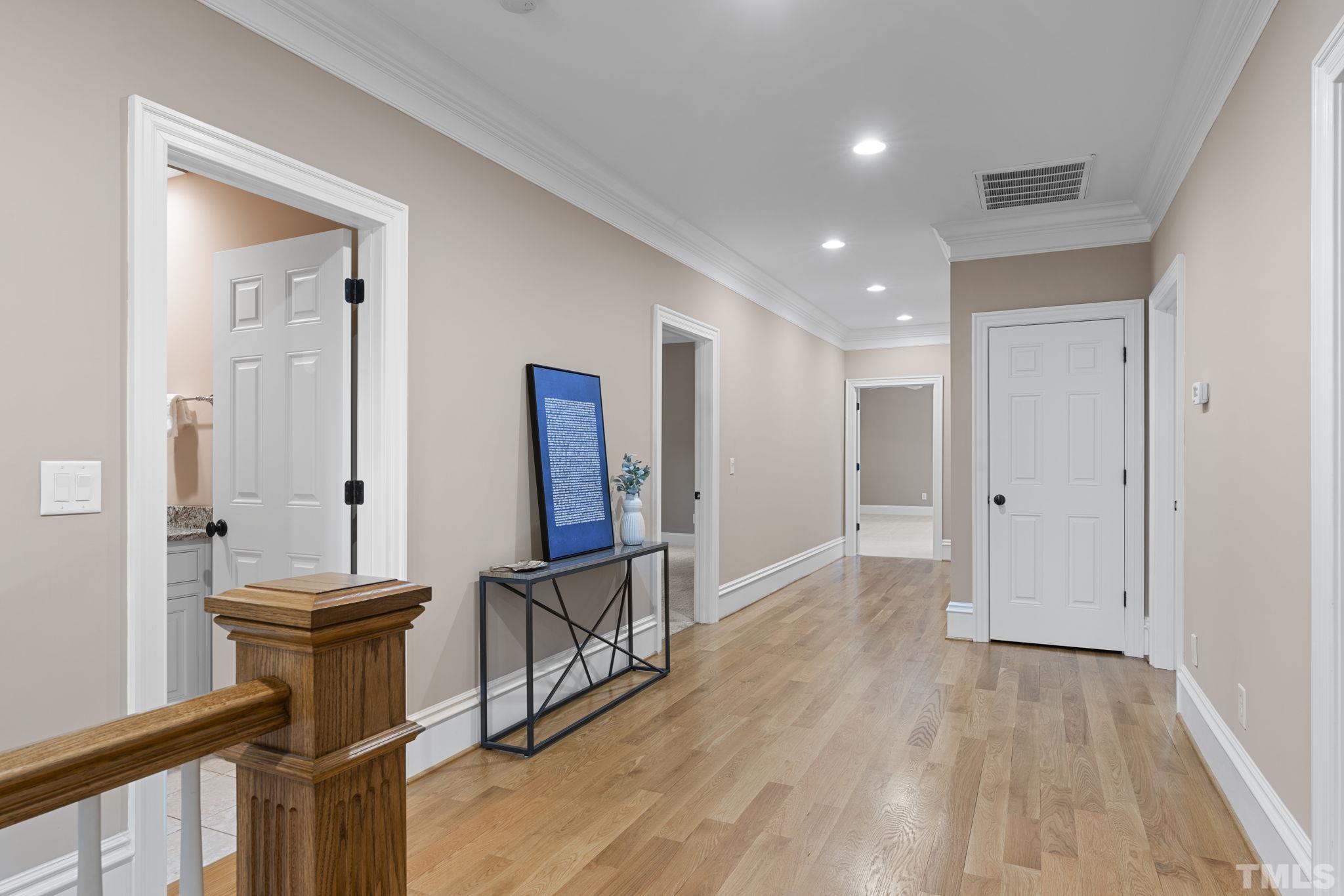 3329 Hampton Road Raleigh, NC 27607 - Photo 27 of 46 a view of a hallway with wooden floor and furniture