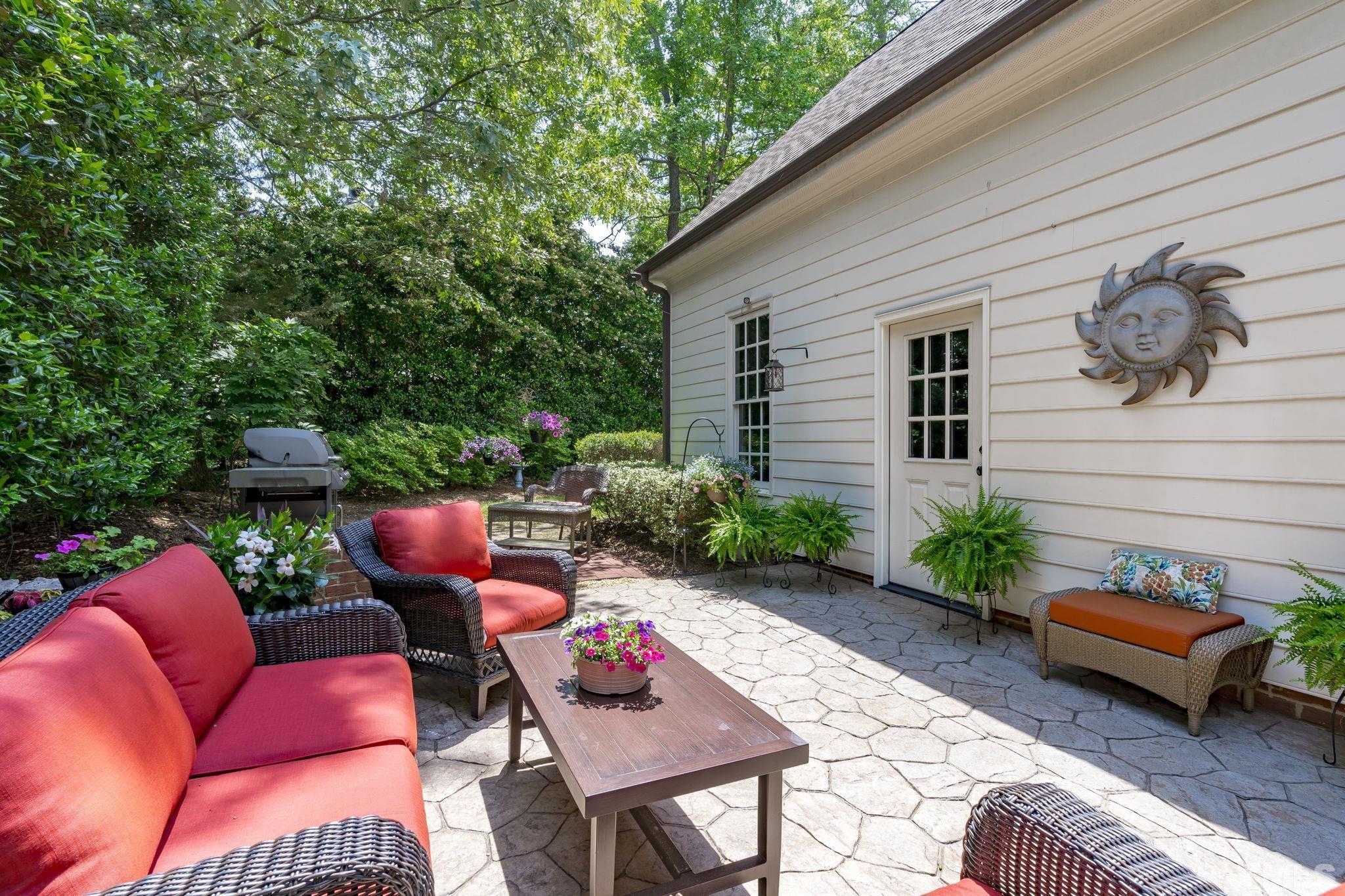 3329 Hampton Road Raleigh, NC 27607 - Photo 42 of 46 a backyard of a house with table and chairs