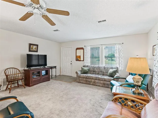a view of a dining room with furniture and window