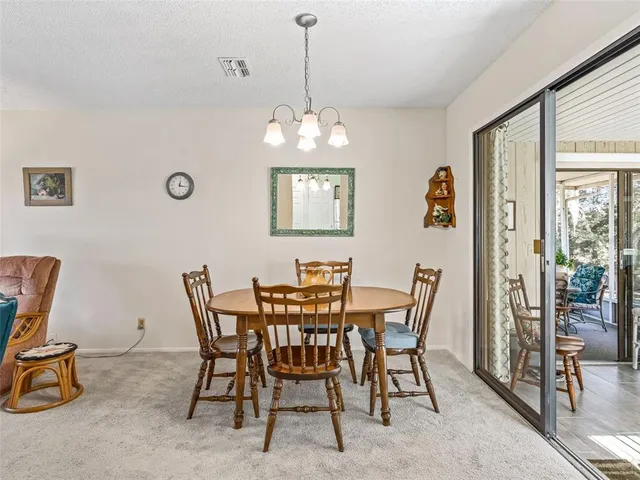 a kitchen with stainless steel appliances a stove microwave and refrigerator