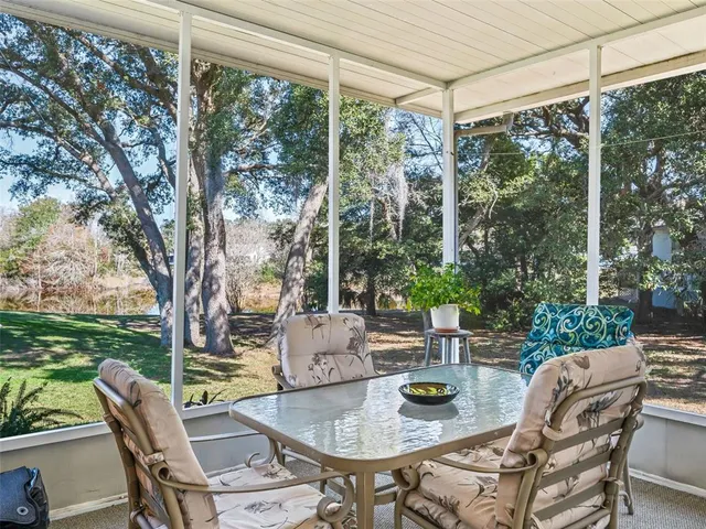 an aerial view of residential houses with outdoor space and city view