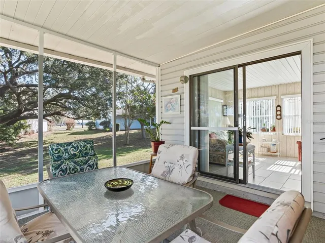an aerial view of residential houses with outdoor space and street view
