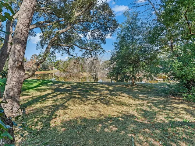 a view of a backyard with sitting area