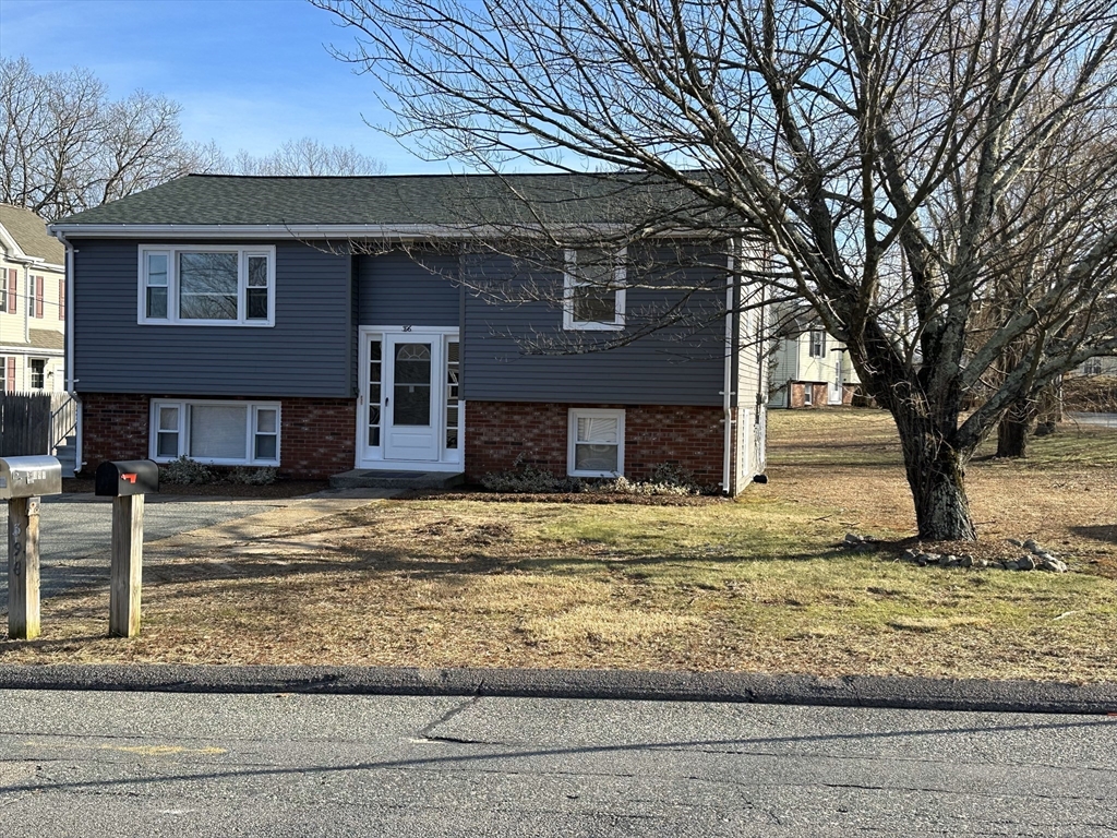 396 Brown Street Attleboro, MA 02703 - Photo 1 of 19 a front view of a house with a yard