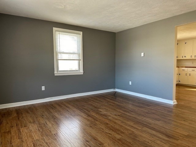 396 Brown Street Attleboro, MA 02703 - Photo 12 of 19 a view of an empty room with wooden floor and a window