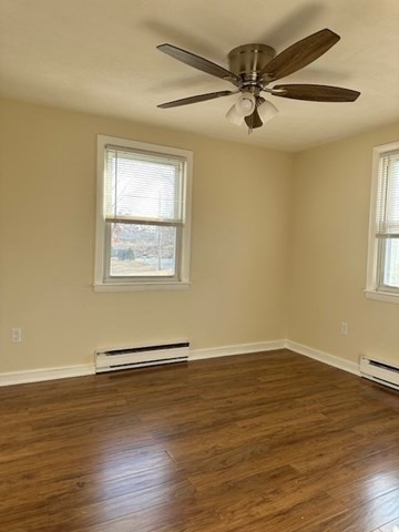 396 Brown Street Attleboro, MA 02703 - Photo 16 of 19 a view of a room with wooden floor and a ceiling fan