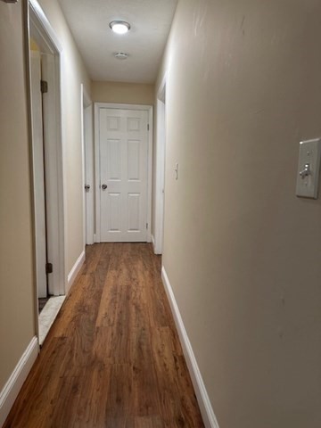 396 Brown Street Attleboro, MA 02703 - Photo 18 of 19 a view of a hallway with wooden floor
