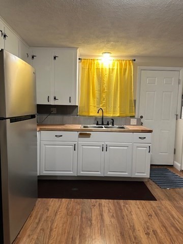 396 Brown Street Attleboro, MA 02703 - Photo 2 of 19 a kitchen with a sink and cabinets
