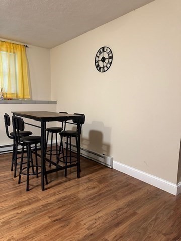 396 Brown Street Attleboro, MA 02703 - Photo 5 of 19 a view of a dining room with furniture and wooden floor