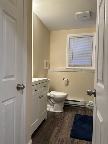396 Brown Street Attleboro, MA 02703 - Photo 6 of 19 a bathroom with a toilet a sink and a window